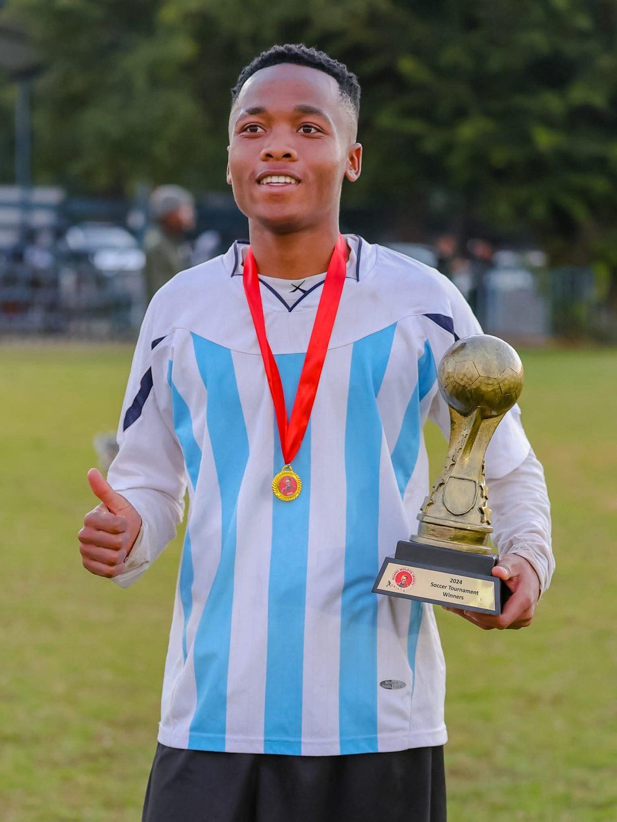 Soccer player with trophy